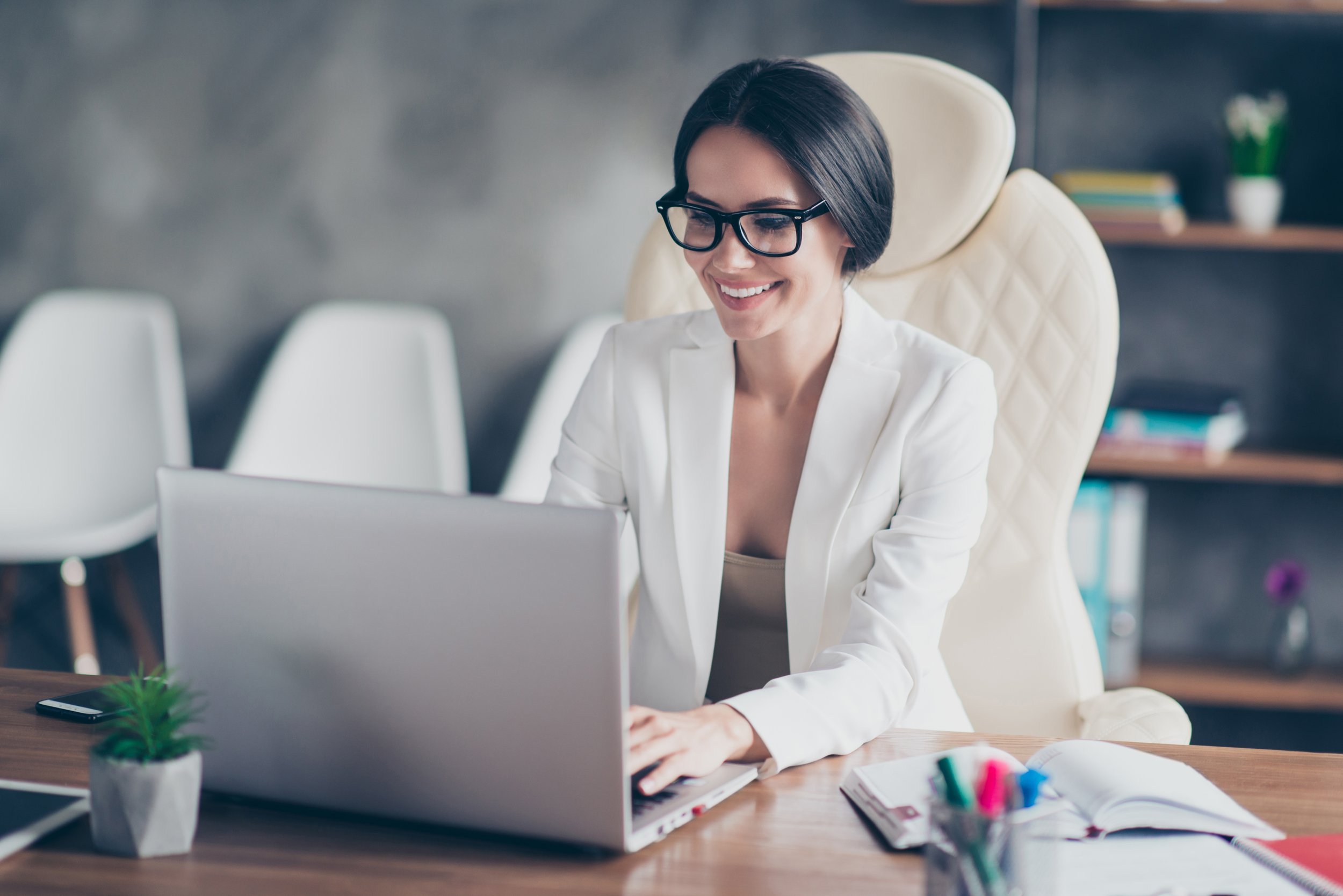 Woman using a laptop in an office space